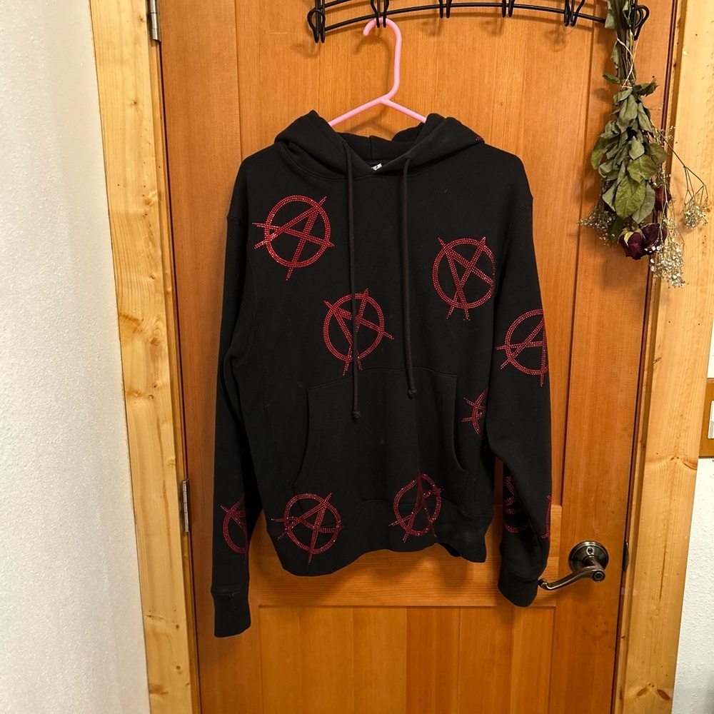 Handmade in LA by toopoor, black hoodie with red rhinestone anarchy symbols.